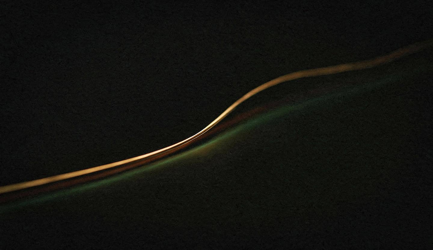 A single amber light trail rising from lower-left to upper-right on a dark ground — calm, compounding momentum.